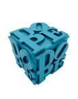 Turquoise laser cut block with 'DOPE' text on a white background